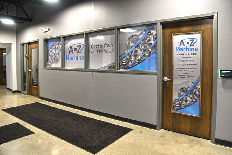 A to Z Machine building interior with A to Z Machine graphics on glass windows and door