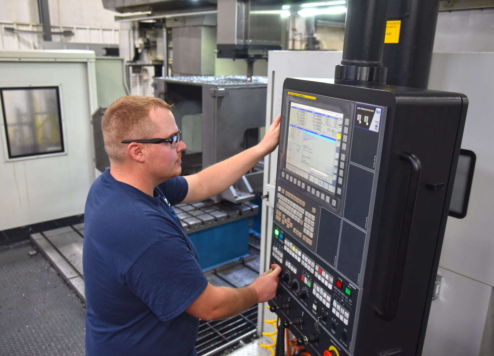 A to Z Machine machinist working on a CNC machine