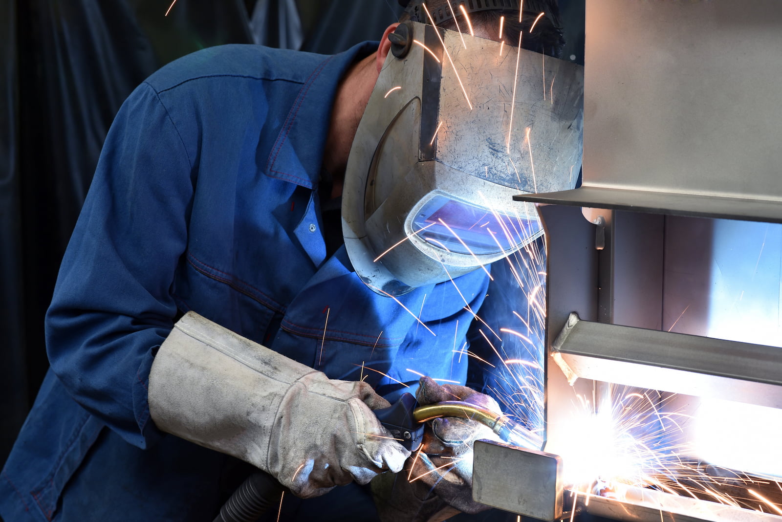 welder working on large metal project