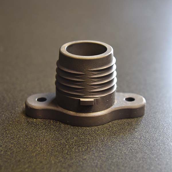 a custom machined flange laying on a table