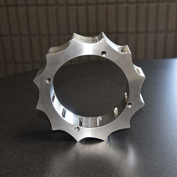 a custom machined gear sitting upright on a table
