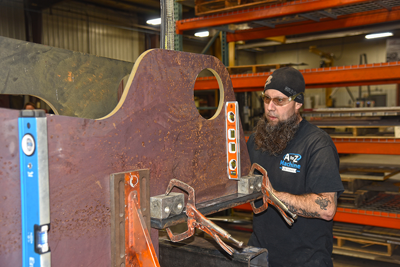 An A to Z Machine employee working on large custom fabrication project