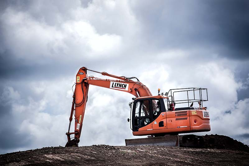 a large excavator digging in the dirt