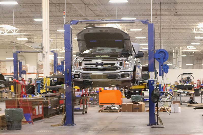 a ford truck on a repair lift